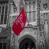 Image of a Temple flag flying on Main Campus.
