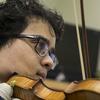 Samuel Nebyu playing the violin.