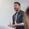 Robert Berry at the front of a classroom talking.