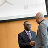 Larry Miller shaking hands with Temple's Jeffery Montague