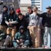 A group of people cheering during the Eagles Super Bowl celebration