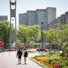 Students walk towards the Bell Tower on Main Campus.
