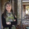 Author and Temple Professor Laura Levitt stands on the front porch of her home.
