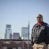 Image of a man in a Temple Police officer jacket outside in North Philadelphia.