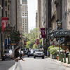 A young woman crosses the street in Center City.