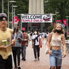 Students walking in front of the Bell Tower on Main Campus.