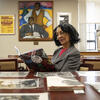 Diane Turner, curator of the Blockson Collection, reads a copy of the collection s new graphic novel, Black Lives Always Mattered!