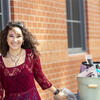 a student smiles while moving out