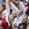 People cheering in the stands at Homecoming