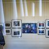 Image of a photo exhibit in a white room on the first floor of Charles Library at Temple University.