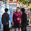 Students standing and talking near food trucks on Main Campus