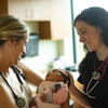 Female physicians with a baby