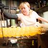 Image of Gemma Hollister creating a glass hamster tube on the set of Blown Away.