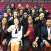 the Temple women s basketball team holding up their fingers to signify No. 1.