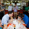 A political candidate eating a cheesesteak in Philadelphia.