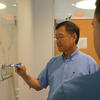 Hai-Lung Dai at a whiteboard