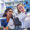 two students examining a document in Temple s Cardiovascular Research Center.