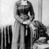 Image of Harriet Tubman standing against a chair.