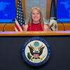 Mergen at State Department podium