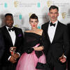 four men and a woman holding British Academy of Film and Television Arts awards.