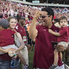 Image of Kevin Negandhi at Temple football game pumping fist in 2015