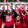 Image of Temple football student fans cheering. 