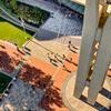 Aerial view of people walking by Temple University's Bell Tower