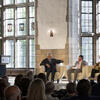 Edmund de Waal, Joe Lucia, and Craig Dykers sitting in chairs speaking to one another