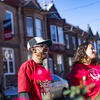 Image of a Temple student and a community member in the neighborhood adjacent to campus.