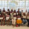 BUILD Philly cohort members holding their completion certificates
