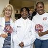 Temple Lang Scholars Program Director Barbara Klock, Temple Lang Medical Scholars Melvin Poulson and his mother Allison Agee