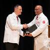 John Colaizzi and S. Suresh Madhavan interact during the ceremony.
