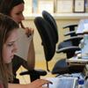Student-journalists using computers in the Philadelphia Neighborhoods newsroom.
