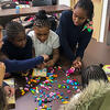 Children work together during the Norris Homes program