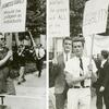 Men and women marching with equality signs in front of Independence Hall.
