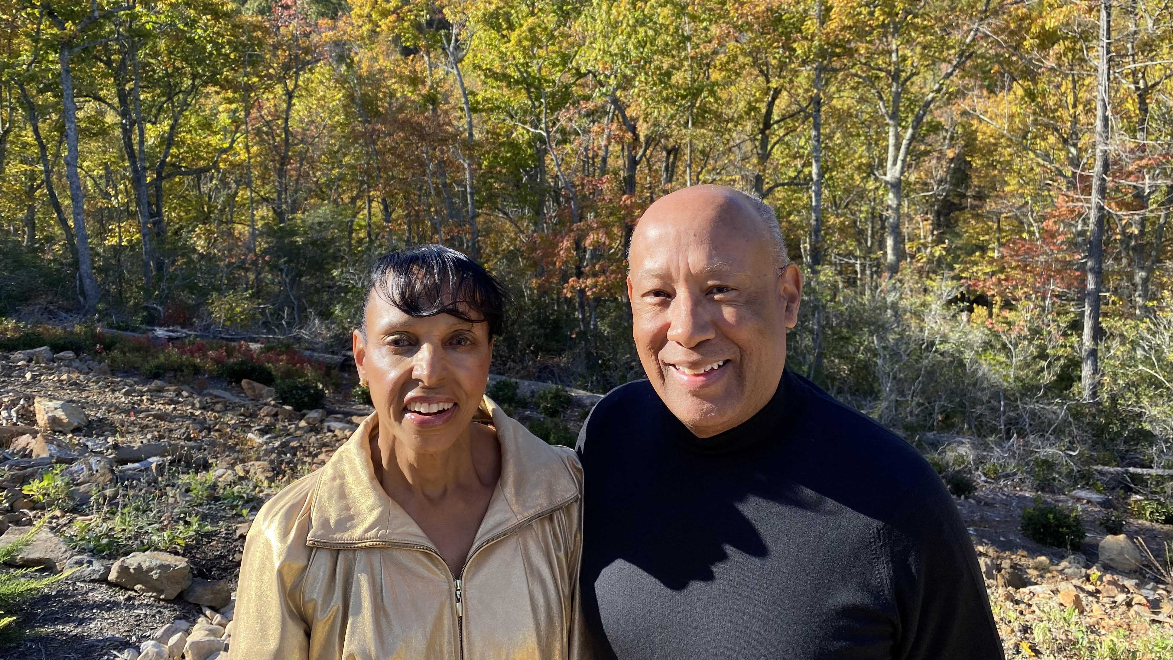 Toni and David Wilkes standing near a creek