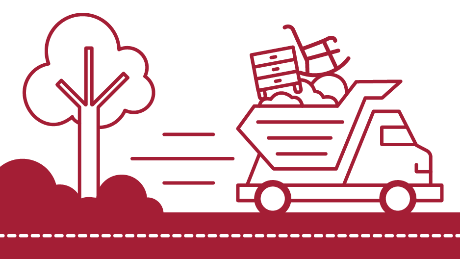 Image of a truck carrying furniture and trash driving past a tree