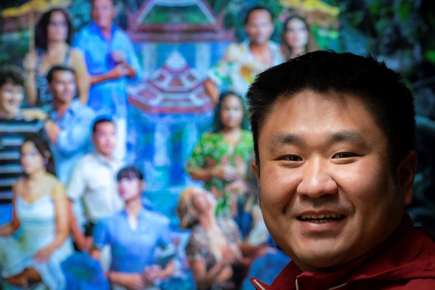 Yang Yang in front of a White Lotus graphic